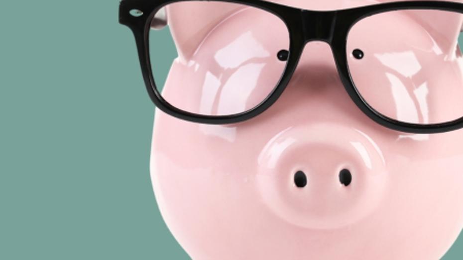 Piggy bank with glasses on